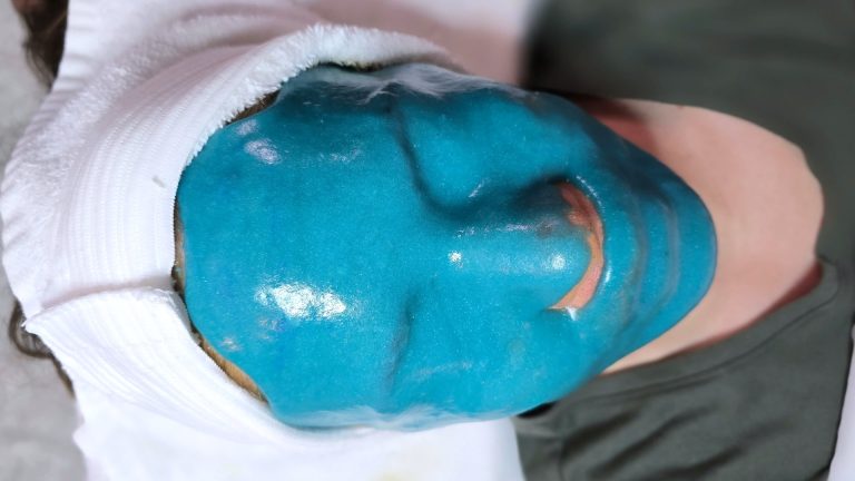 Professional esthetician applying Jelly Masks facial treatment — hydrating, cooling, and peel-off spa mask for refreshed skin.